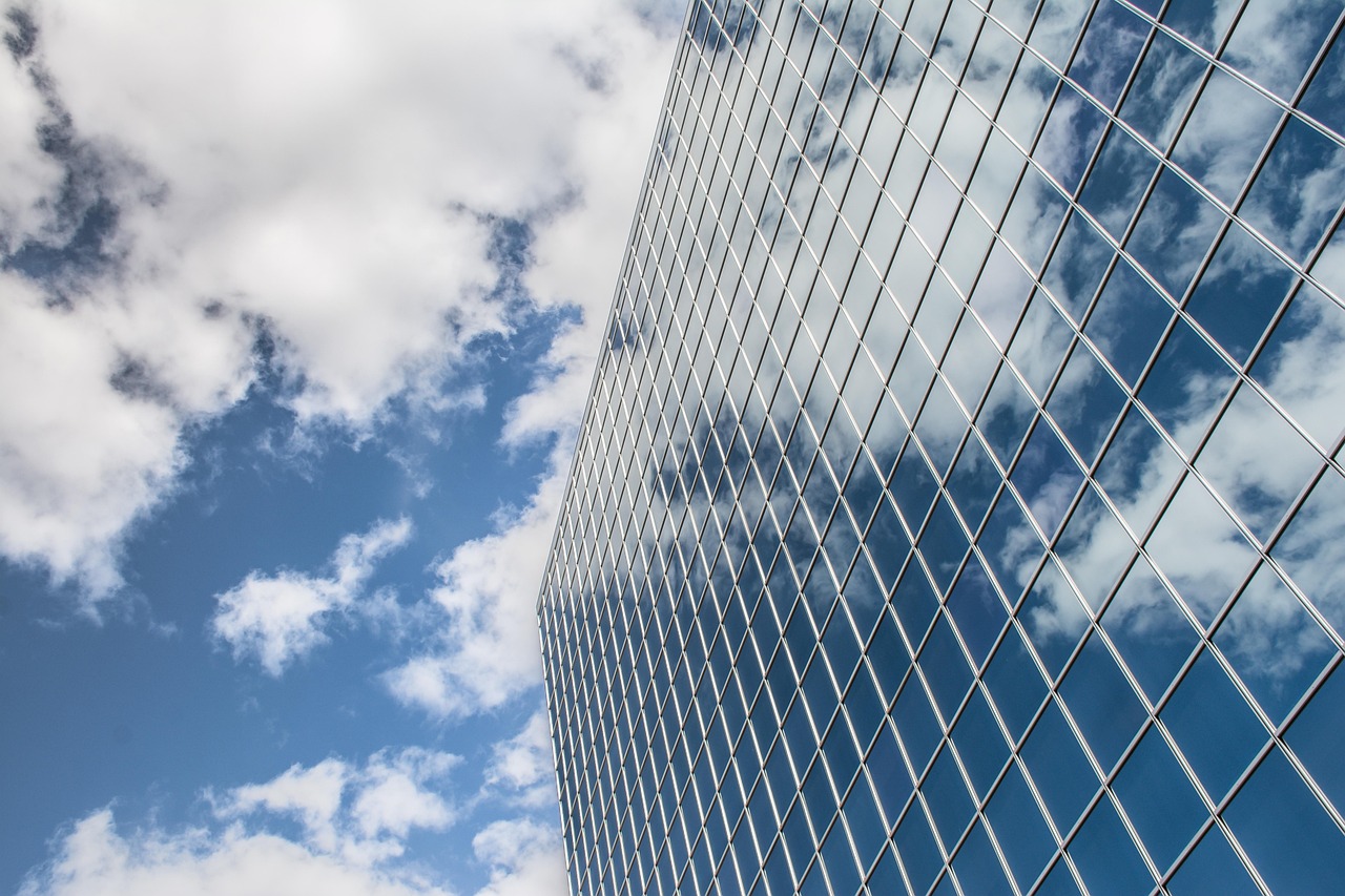 Building, reflection, clouds — Incredible benefits associated with breast implants Miami