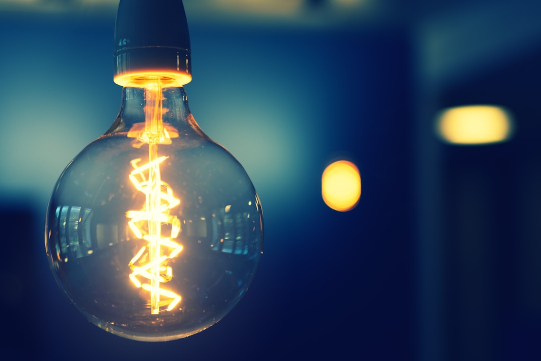 Illuminating light bulb with artistic background